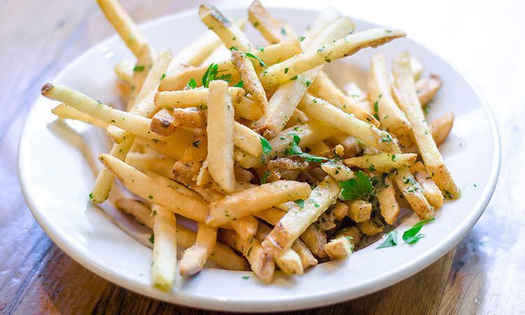 Garlic French Fries · French fries tossed in butter, garlic, parsley, and olive oil