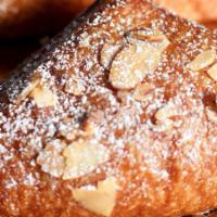 Almond Croissant · (vegetarian) A light and flaky croissant with a sweet almond center