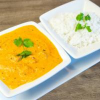 Butter Chicken · Boneless pieces of breast chicken cooked in a fresh tomato sauce with a touch of light cream...
