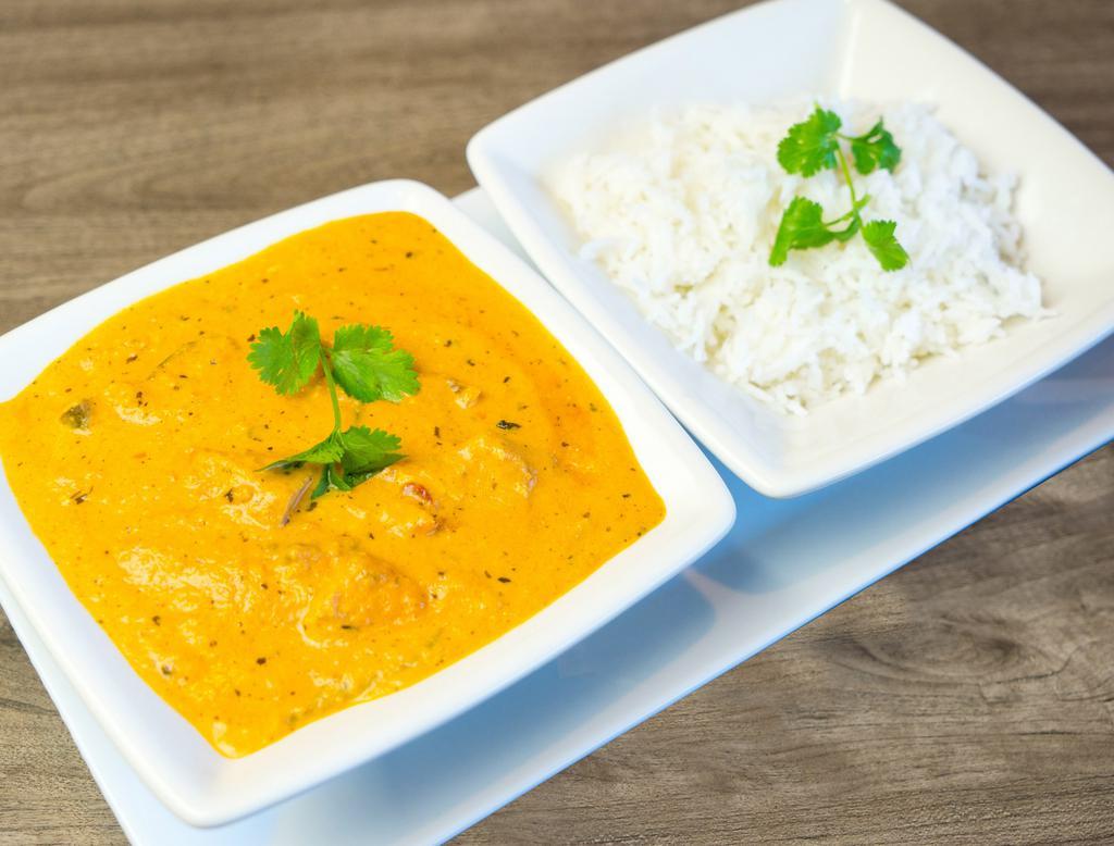 Butter Chicken · Boneless pieces of breast chicken cooked in a fresh tomato sauce with a touch of light cream and warm spices. Include basmati rice. Gluten free, nut free.