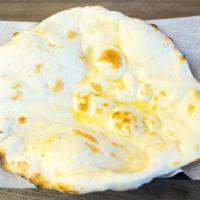 Naan · A traditional unleavened, hand-tossed bread freshly baked in a tandoor clay oven.