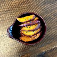 Sweet Potato · Steamed and fried purple sweet potato, served with syrup and sesame.