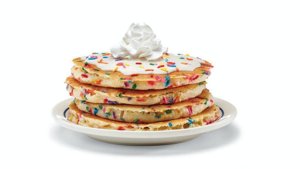 Cupcake Pancakes · Celebrate breakfast! Four fluffy buttermilk pancakes filled with festive rainbow sprinkles. Topped with cupcake icing & crowned with whipped topping. 