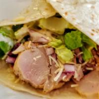 Chicken Caesar wrap  · tortilla wrap, house made grilled chicken, graded Parmesan, onions, lettuce, red onion, Caes...