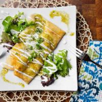 Chicken Enchilada Crepe · Chicken, Monterrey cheese top with green sauce sour cream and cotija cheese