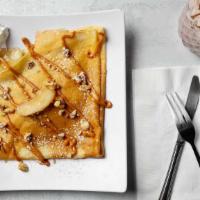 Goyi Crepe · Apple Pie Filling. Topped with dulce de leche, walnuts and cinnamon sugar.