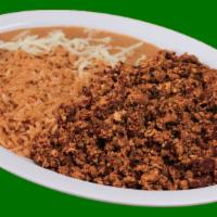 Chorizo and Eggs · Sausage and egg with tortillas, refried beans, cheese and rice.