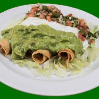 Chicken Flautas · Rolled Taquitos. 4 chicken rolled taquitos topped with sour cream, guacamole and pico de gal...