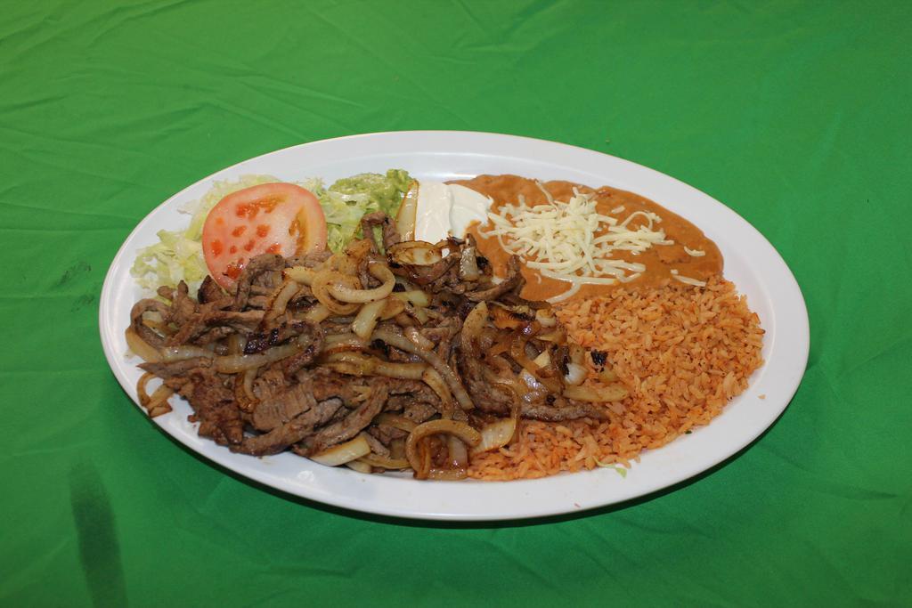 Bistec Encebollado Plate · Beef sauteed in onions and seasonings. Served with rice, refried beans, cheese, lettuce, guacamole sour cream and tortillas.