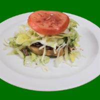 Sope · Fried corn tortilla topped with re-fried beans, choice of meat, lettuce, sour cream, guacamo...
