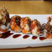 Spider Roll · Lightly breaded crispy soft shell crab, lettuce and roe inside.
