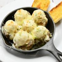 Crab Stuffed Mushrooms · Homemade seafood stuffing, topped with Monterey jack and Alfredo sauce. Served with garlic b...