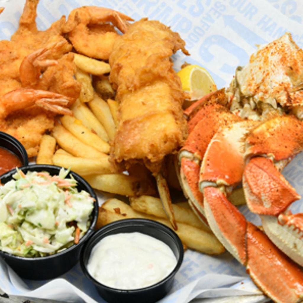 Captain's Plate · BBQ Snow Crab, crispy fried shrimp, fried fish fillet with fries and coleslaw.