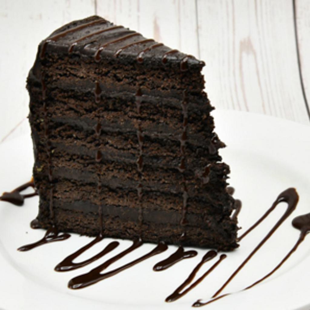 Chocolate Shack Attack · Six hearty layers of dark chocolate cake separated by rich chocolate ganache.