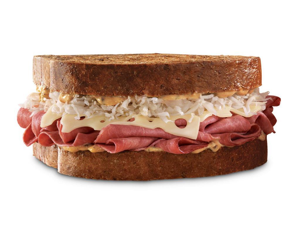 Reuben · Thinly sliced corned beef with melted Swiss cheese, tangy sauerkraut and creamy Thousand Island dressing on toasted marble rye bread. Visit arbys.com for nutritional and allergen information.
