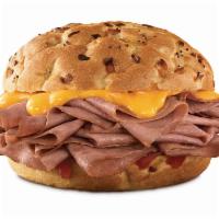 Beef 'n Cheddar 1/2 lb. Sandwich · A half pound of thinly sliced roast beef, with cheddar cheese sauce and zesty red ranch sauc...