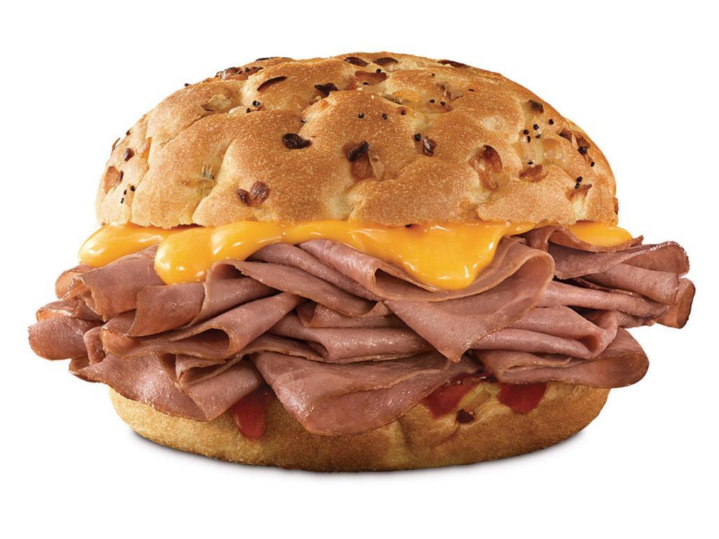 Beef 'n Cheddar 1/2 lb. Sandwich · A half pound of thinly sliced roast beef, with cheddar cheese sauce and zesty red ranch sauce on a toasted onion roll. Visit arbys.com for nutritional and allergen information.
