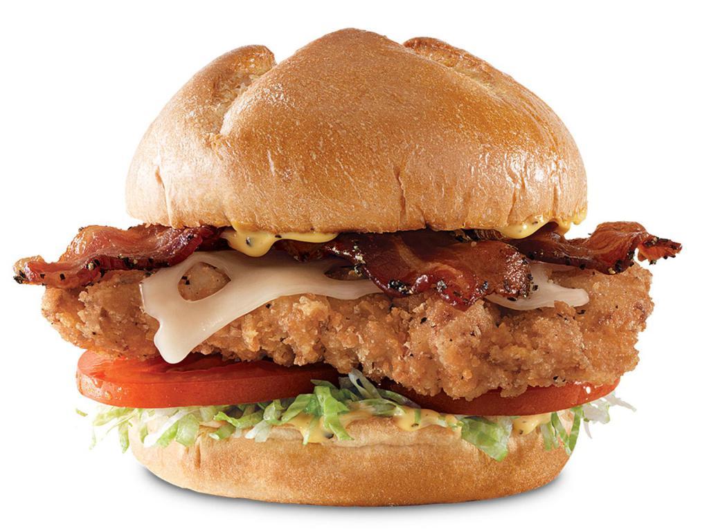 Buttermilk Chicken Bacon 'n Swiss Meal · A crispy buttermilk chicken fillet with thick-cut pepper bacon, melted Swiss cheese, lettuce, tomato and honey mustard on a toasted star top bun. Meal includes choice of side and drink. Visit arbys.com for nutritional and allergen information.