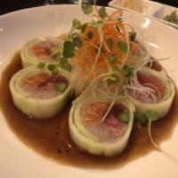 Chef Special Roll · Tuna, salmon, yellow tail, radish and asparagus wrapped with cucumber with Sakana Ponzu sauce.