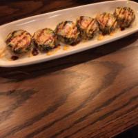 Vegas Roll · Deep fried roll inside salmon, avocado, crab meat, and cream cheese with eel sauce and spicy...
