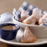 Biscuit Beignets · Our buttermilk biscuit dough, deep-fried then tossed in cinnamon sugar with
butter pecan sa...