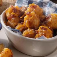 Loaded Hashbrown Casserole Tots · Our Hashbrown Casserole fried into crispy bite-sized tater tots loaded with bacon and melted...