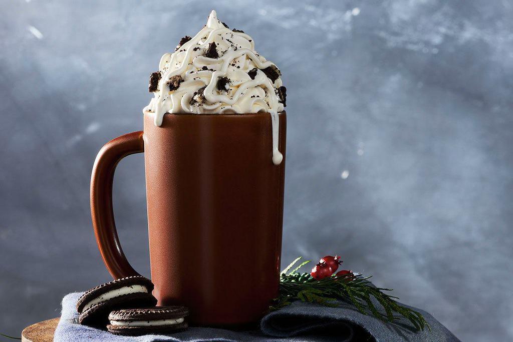 Cookies n' Crème Hot Chocolate  · Hot chocolate topped with crushed chocolate cookies and cookies n’ creme sauce.