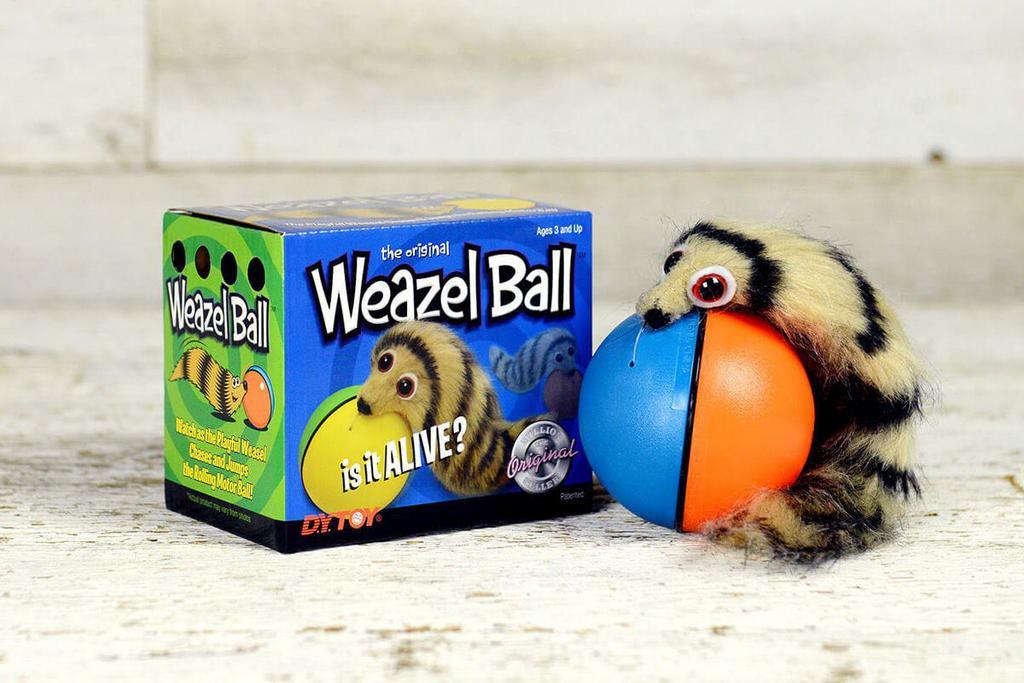 Weazel Ball · Is it alive? The playful weazel chases and jumps the rolling motorball. The Weazel Ball ® is a fun surprise for all ages and is sure to bring hours of enjoyment. Requires 1 ?AA? battery, not included. Approximately 12? long. Ages 3 and up. Warning: Choking hazard - small parts. Not for children under 3 years.