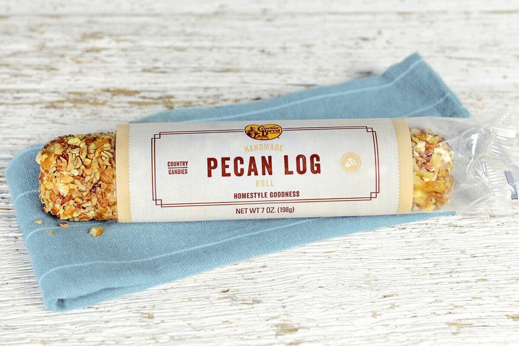 Pecan Log - 7oz. · An old-fashioned tradition. Our Pecan Logs are a handmade creation of rich nougat, dipped in creamy caramel, then hand-rolled in fresh chopped pecans. Great as a snack or slice a few to serve to guests.