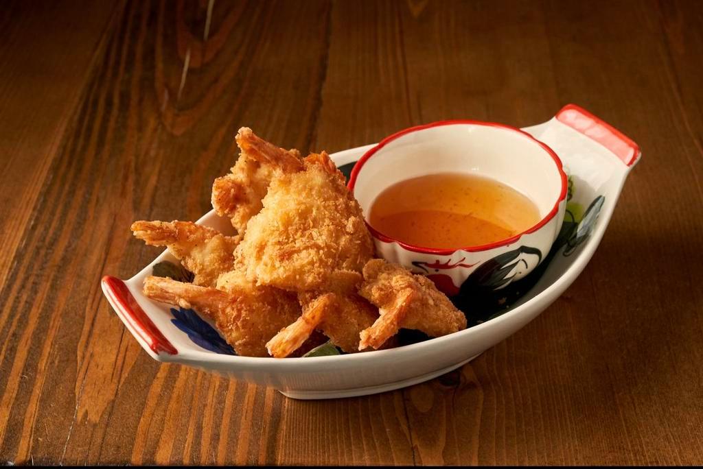 Goong Ma Prow 🍤 · Deep Fried Coconut Battered Butterfly Shrimp Served with Sweet Plum Sauce