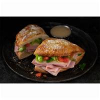 Ham and Cheese Deli Boat · Calzone style sandwich baked with pizza dough stuffed with ham, provolone, lettuce & tomatoe...