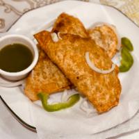 Samosa · 3 pieces of fried pastry filled with potaoes, onions, & peas