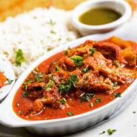 Chicken Korma · Afghan style chicken cooked in tomattes and onion based sauce