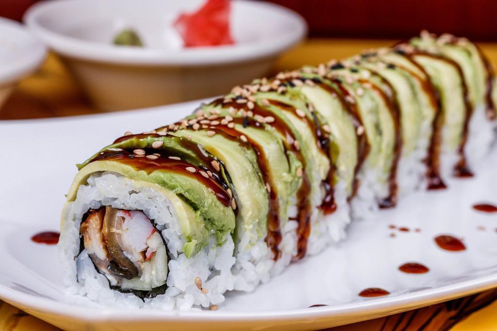 Caterpillar Roll · Inside fresh water eel, crab meat, and cucumber, outside avocado eel sauce.