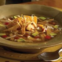 Tortilla Soup · Our savory blend of seasoned chicken and garden fresh vegetables. Served with a side of sour...