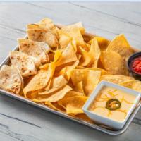 Queso Dip · Taco Mac Team Favorite: Served with tortilla chips and tortillas.
