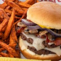 The Fox · Two juicy 4 oz patties with sautéed mushrooms and caramelized onion, bacon, Swiss, ketchup, ...