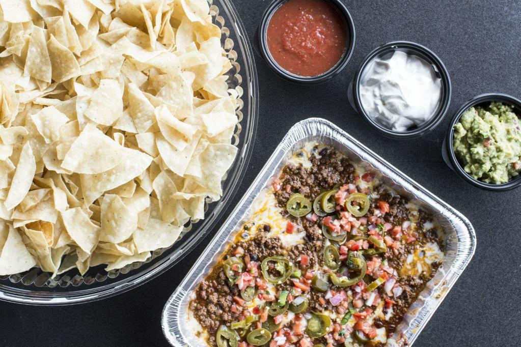 Nachos All the Way PP · Taco Mac Team Favorite: Seasoned beef, chili, black beans, queso dip, cheese, pico de gallo, pickled jalapenos with salsa, sour cream, guacamole, tortilla chips on the side. Serves 8.