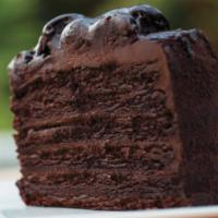 Colossal Double Chocolate Cake · Layers of dark chocolate cake, chocolate filling, chocolate chip chunks.