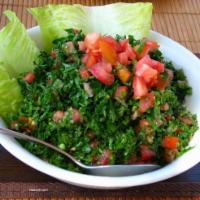 Tabbouleh Salad · Tabouleh is a fresh parsley salad mixed with cracked wheat, tomatoes, mint, onions, lemon ju...