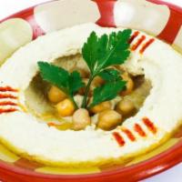 Hummus and Pita · Hummus is a smooth thick mixture of mashed chickpeas, mixed with tahini, lemon juice, and ga...