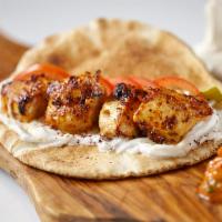 Shish Taouk Kabob Pita Wrap · Shish taouk kabob sandwich is a tender marinated chicken breast, with our traditional Lebane...