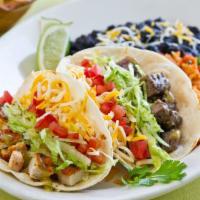 California Chicken Taco Plate · 2 tacos. Lettuce, tomatoes, cheese and salsa. Served with choice of tortilla and side.