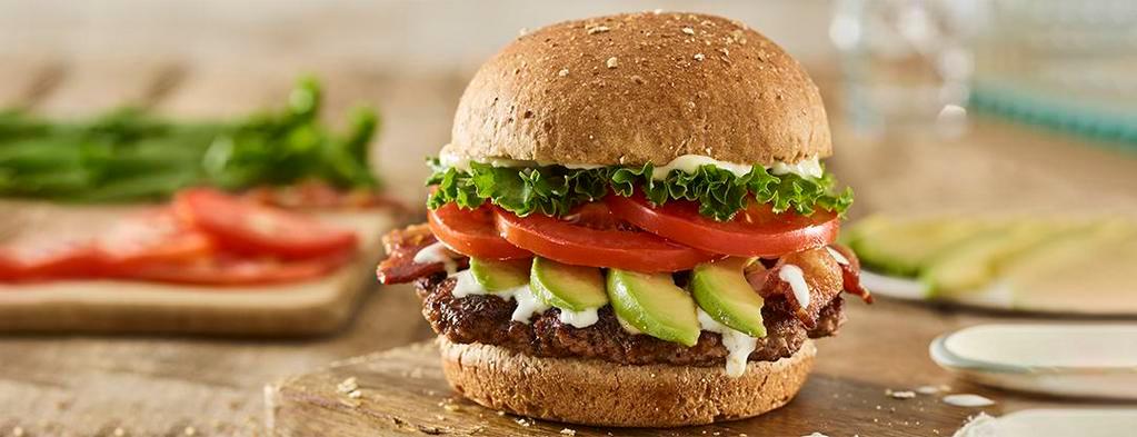 Avocado Bacon Club Burger · Certified Angus Beef, sliced avocado, applewood smoked bacon, lettuce, tomatoes, ranch, mayo, toasted multi-grain bun.