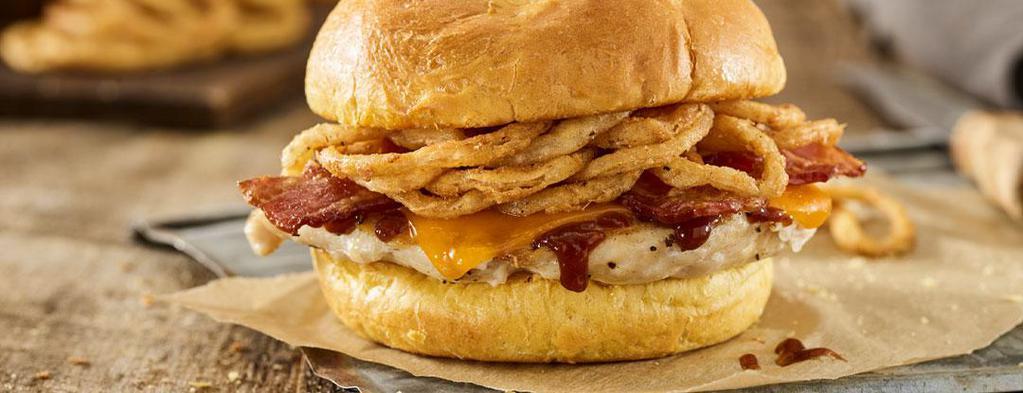 BBQ Bacon Cheddar Grilled Chicken Sandwich · Grilled chicken breast, BBQ sauce, applewood smoked bacon, cheddar and haystack onions on a toasted classic bun.
