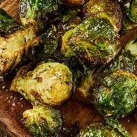Brussels Sprouts · Crispy Brussles tossed with garlic, spices, served with ranch.