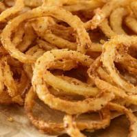 Haystack Onions · Crispy, fried onion straws served with ranch dressing.