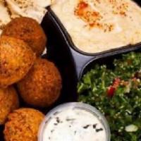 #6 Falafel Plate · Our famous falafel balls served with hummus and tabouli salad with pita bread