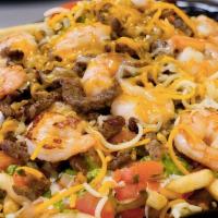 * Surf ＆ Turf Fries · Steak, shrimp, cheese, salsa fresca, guacamole and house sauce.