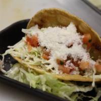 * Shredded Chicken Taco · Lettuce, cheese and salsa fresca.
